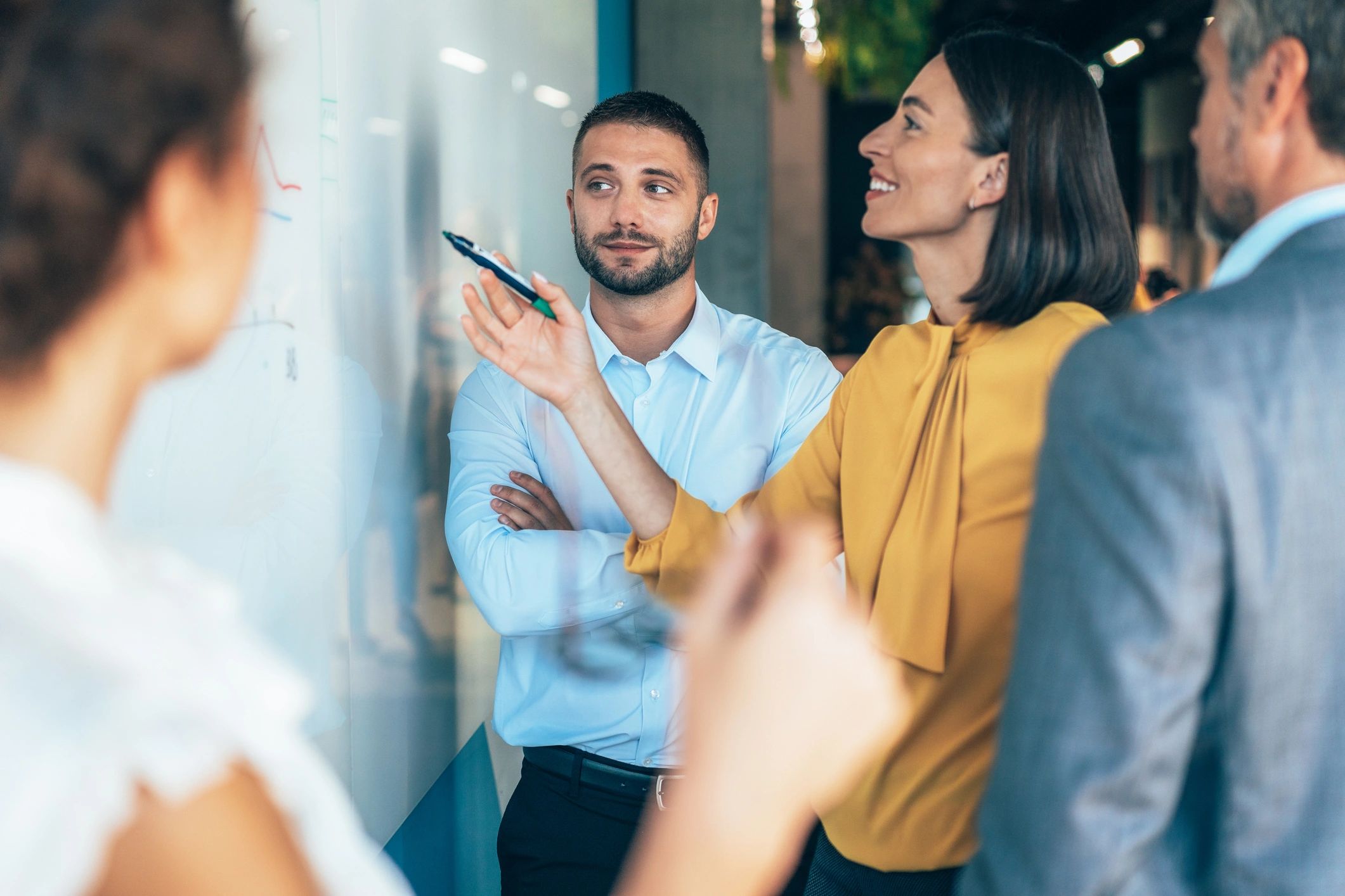 Startup team planning strategy at a whiteboard
